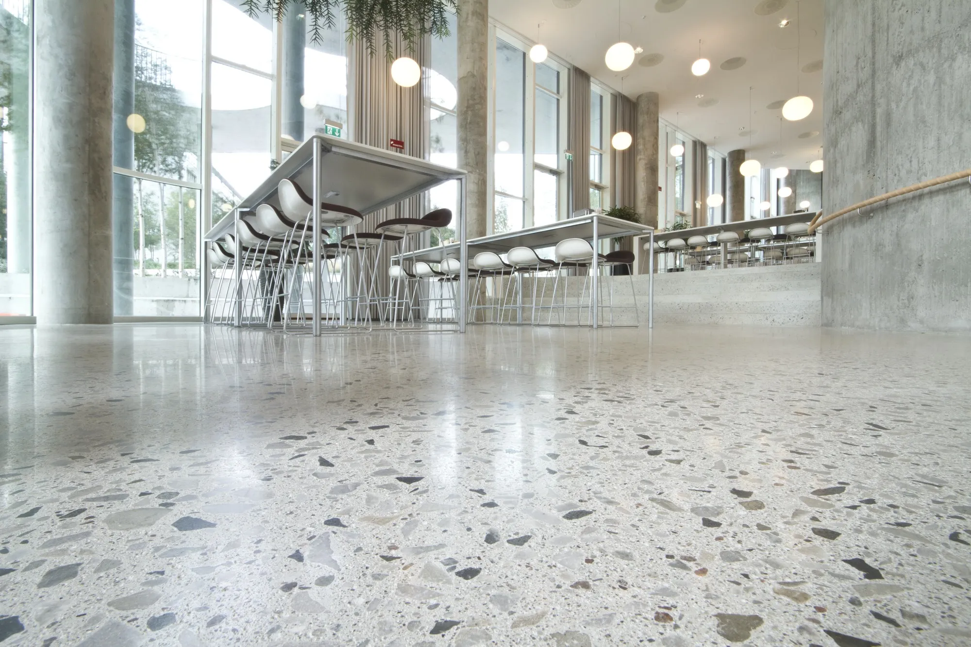 Polished concrete floor with exposed aggregate in a modern commercial space
